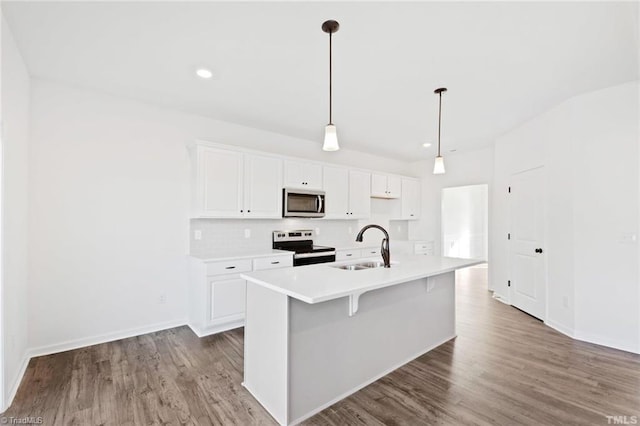 145 Oakmont Ln, King, NC 27021 - kitchen featuring stainless steel appliances, a sink, white cabinets, light countertops, and recessed lighting