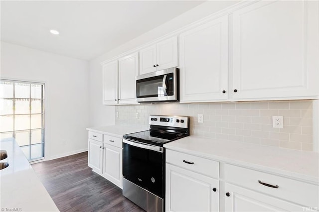 145 Oakmont Ln, King, NC 27021 - kitchen with appliances with stainless steel finishes, dark wood-type flooring, white cabinets, and baseboards
