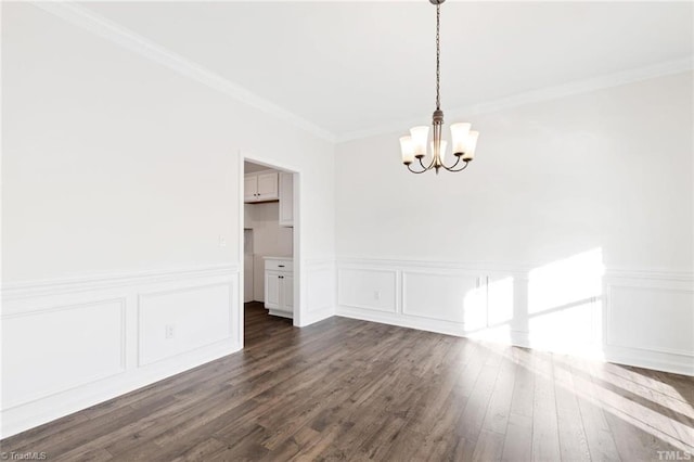 145 Oakmont Ln, King, NC 27021 - unfurnished dining area with a chandelier, dark wood-style floors, crown molding, wainscoting, and a decorative wall