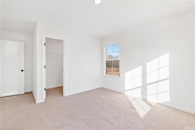 145 Oakmont Ln, King, NC 27021 - unfurnished bedroom with carpet floors, a spacious closet, baseboards, and a closet