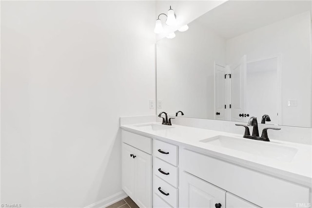 145 Oakmont Ln, King, NC 27021 - bathroom with double vanity, tile patterned floors, and baseboards