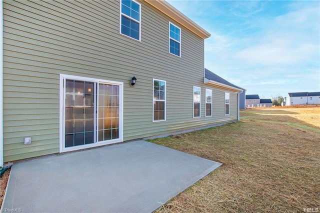 145 Oakmont Ln, King, NC 27021 - back of house featuring a patio and a lawn