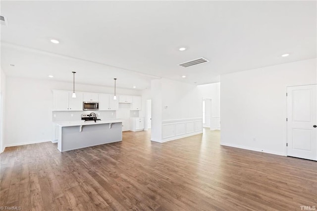 145 Oakmont Ln, King, NC 27021 - unfurnished living room featuring wood finished floors and recessed lighting