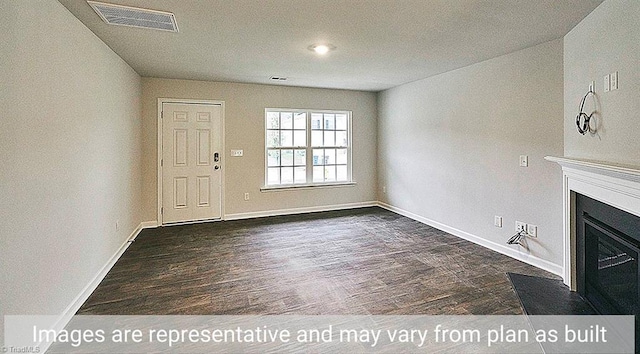 unfurnished living room with dark hardwood / wood-style floors