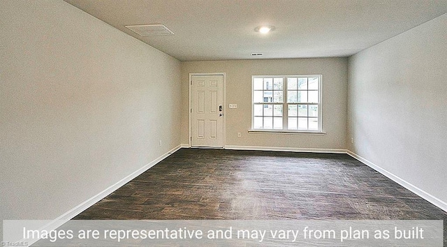 empty room with dark hardwood / wood-style floors