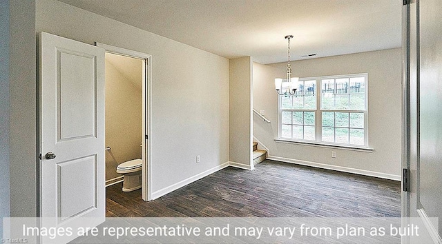 unfurnished dining area featuring dark hardwood / wood-style flooring and a chandelier