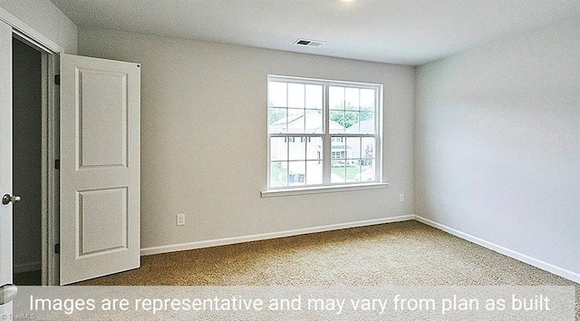 spare room featuring carpet flooring