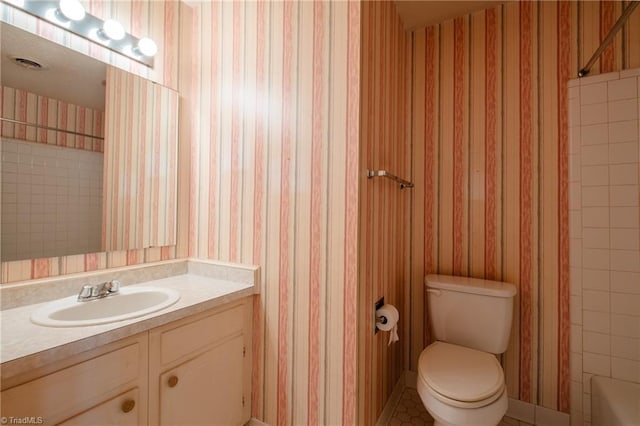 full bathroom with visible vents, toilet, wallpapered walls, and vanity