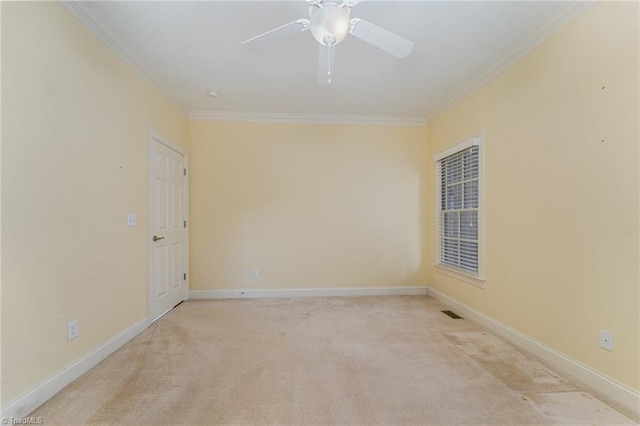 unfurnished room featuring light carpet, crown molding, and ceiling fan