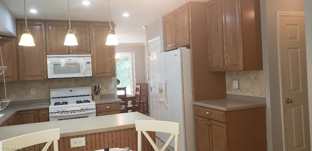 2007 Kildare Woods Dr, Greensboro, NC 27407 - kitchen with white appliances, backsplash, light countertops, decorative light fixtures, and recessed lighting