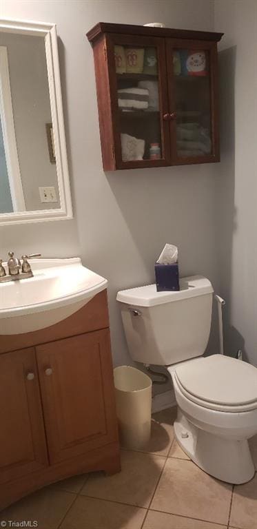 2007 Kildare Woods Dr, Greensboro, NC 27407 - bathroom featuring toilet, vanity, and tile patterned flooring