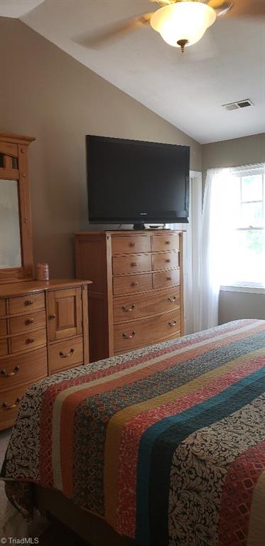 2007 Kildare Woods Dr, Greensboro, NC 27407 - bedroom featuring vaulted ceiling and a ceiling fan