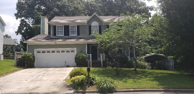 2007 Kildare Woods Dr, Greensboro, NC 27407 - view of front facade with a chimney, a front lawn, concrete driveway, a detached carport, and a garage