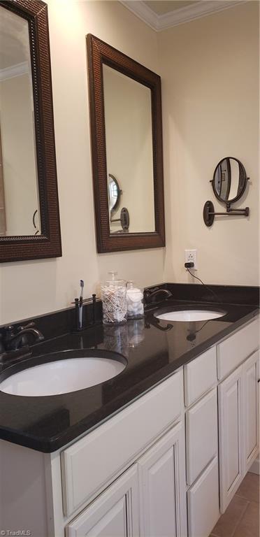 2007 Kildare Woods Dr, Greensboro, NC 27407 - bathroom featuring ornamental molding and double vanity