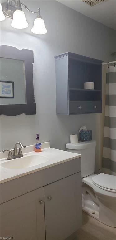 2007 Kildare Woods Dr, Greensboro, NC 27407 - full bathroom with toilet, vanity, and a shower with curtain