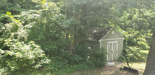 2007 Kildare Woods Dr, Greensboro, NC 27407 - view of shed with a view of trees