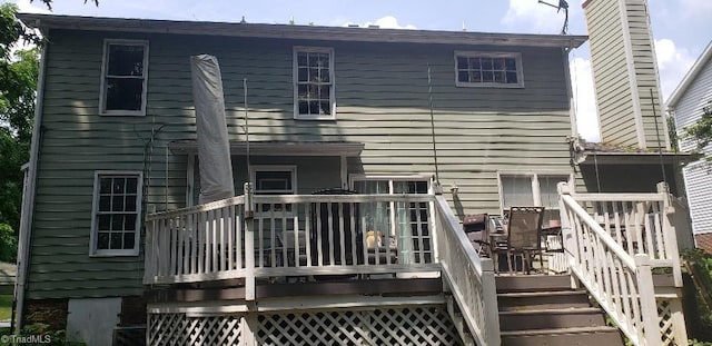 2007 Kildare Woods Dr, Greensboro, NC 27407 - rear view of house with a chimney, a deck, and stairs