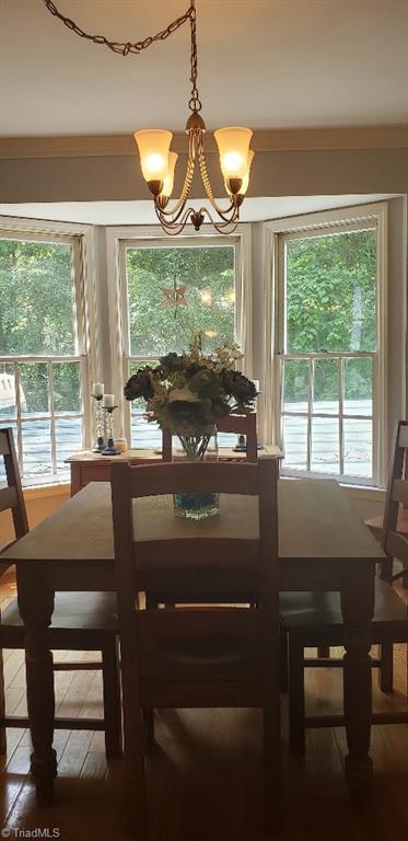 2007 Kildare Woods Dr, Greensboro, NC 27407 - dining area with a chandelier and hardwood / wood-style floors