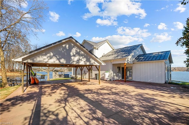 modern inspired farmhouse with a water view and a carport