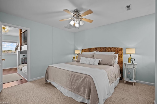 bedroom featuring ceiling fan and carpet