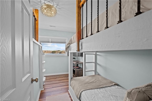 bedroom with wood-type flooring