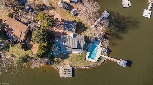 birds eye view of property with a water view