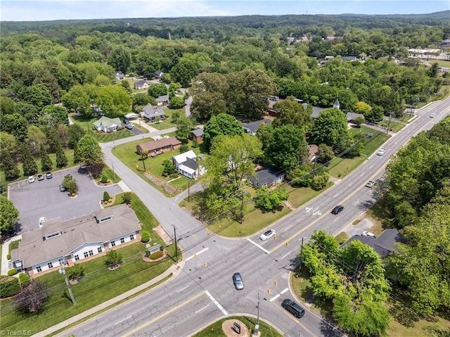 drone / aerial view featuring a view of trees