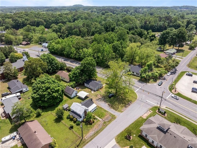bird's eye view featuring a residential view and a forest view