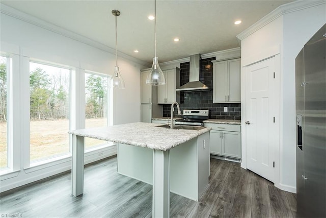kitchen with tasteful backsplash, wall chimney exhaust hood, crown molding, and a sink