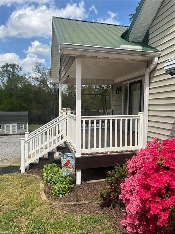 wooden terrace featuring covered porch