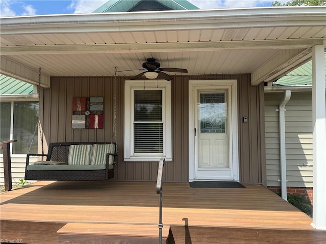 property entrance featuring board and batten siding and covered porch