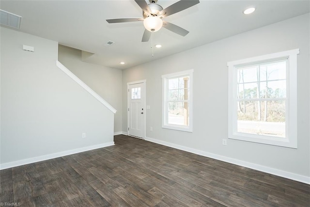 foyer with dark hardwood / wood-style flooring and ceiling fan