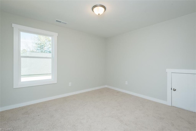 unfurnished room featuring carpet floors