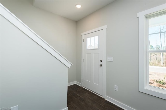 foyer entrance with dark wood-type flooring