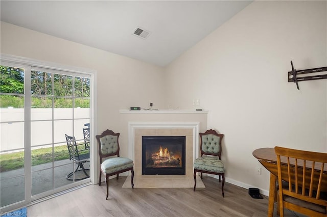 3972 Creekside Ct, Winston-Salem, NC 27127 - living area with a fireplace, wood finished floors, lofted ceiling, and baseboards