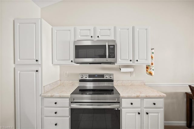 3972 Creekside Ct, Winston-Salem, NC 27127 - kitchen featuring appliances with stainless steel finishes and white cabinets