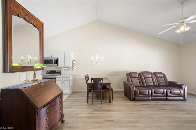 3972 Creekside Ct, Winston-Salem, NC 27127 - living area featuring a chandelier, a ceiling fan, lofted ceiling, light wood-style flooring, and baseboards