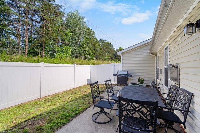 3972 Creekside Ct, Winston-Salem, NC 27127 - view of patio with outdoor dining space and a grill