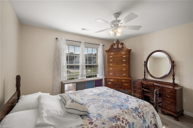 3972 Creekside Ct, Winston-Salem, NC 27127 - bedroom with wood finished floors, ceiling fan, and baseboards