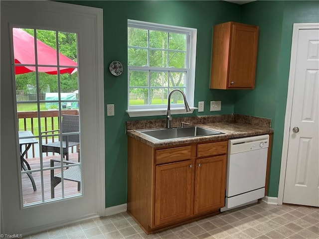 10 Dunlevy Way, Greensboro, NC 27455 - kitchen featuring dishwasher, a sink, dark countertops, and baseboards