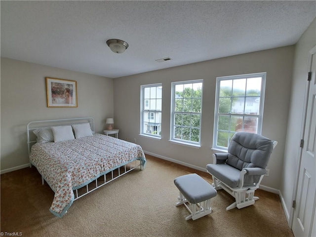 10 Dunlevy Way, Greensboro, NC 27455 - bedroom featuring carpet flooring, baseboards, and a textured ceiling