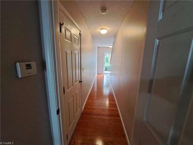 10 Dunlevy Way, Greensboro, NC 27455 - corridor with a textured ceiling, wood finished floors, and baseboards