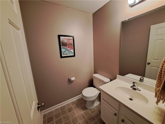 10 Dunlevy Way, Greensboro, NC 27455 - half bathroom featuring vanity, toilet, baseboards, and a textured ceiling