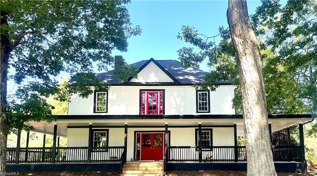937 Haynes Rd, Summerfield, NC 27358 - view of front facade with a porch and a chimney