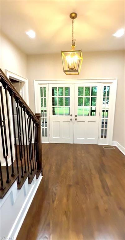 937 Haynes Rd, Summerfield, NC 27358 - entrance foyer with french doors, wood finished floors, and stairs