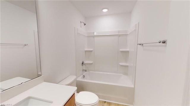 full bathroom with vanity, shower / bath combination, and toilet