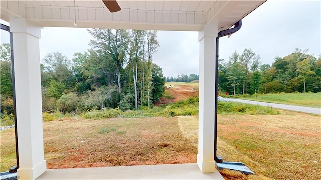 view of yard with ceiling fan