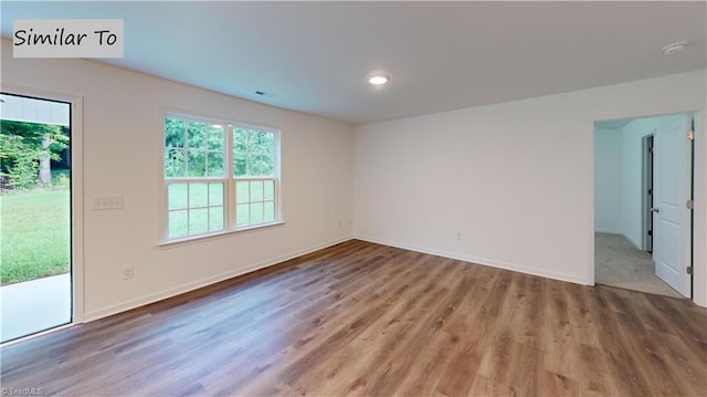 empty room featuring hardwood / wood-style flooring