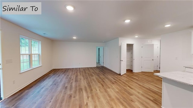 unfurnished living room featuring light wood-type flooring