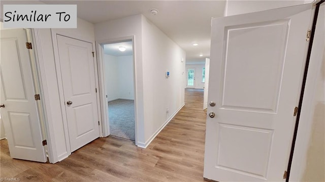 hallway featuring light hardwood / wood-style flooring